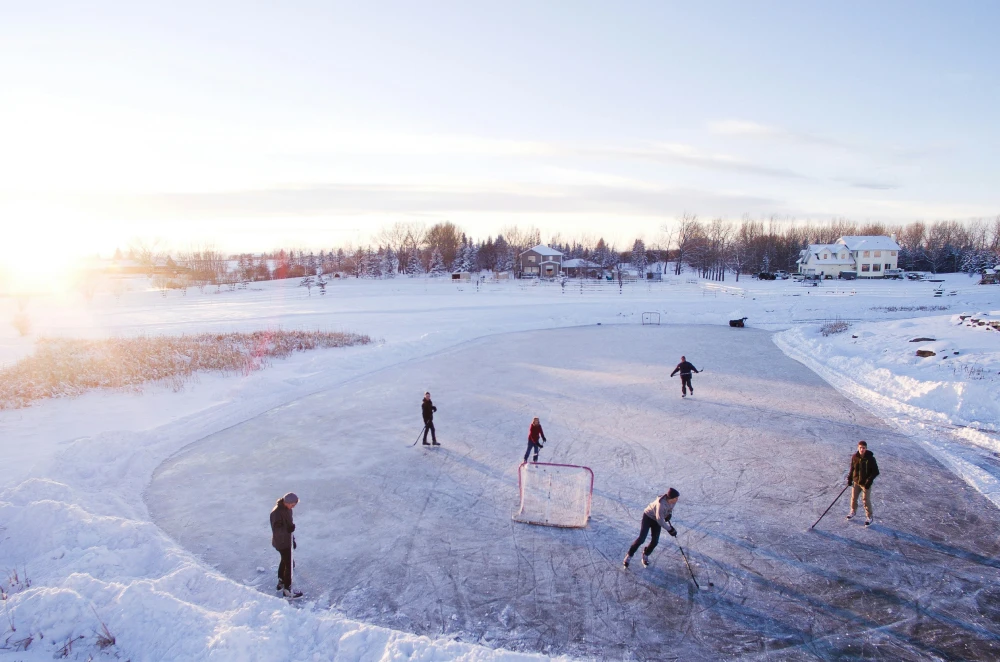Certified ice skating instructor helping a student
