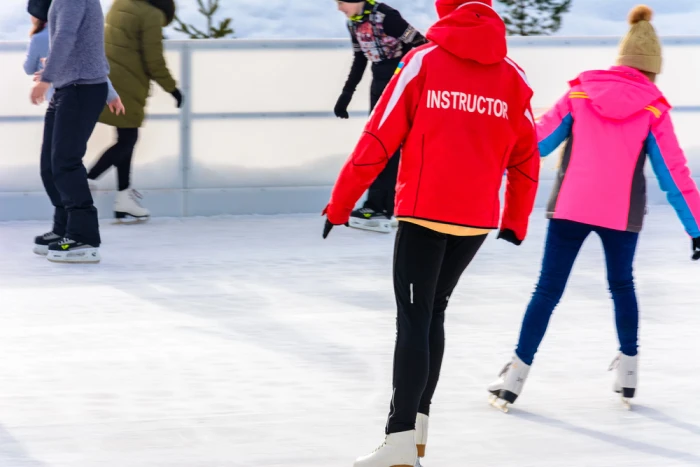 Sarah M. smiling on the ice rink